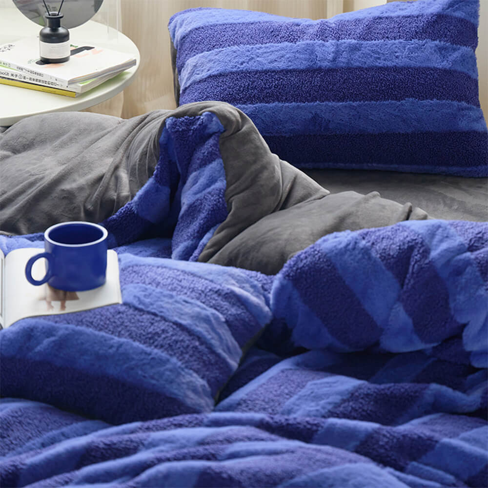 Juego de sábanas a rayas acogedoras de doble cara